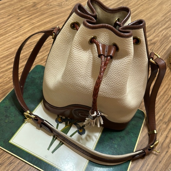 Dooney & Bourke Handbags - Dooney & Bourke bucket bag purse drawstring All Weather Tan Brown pebble Leather